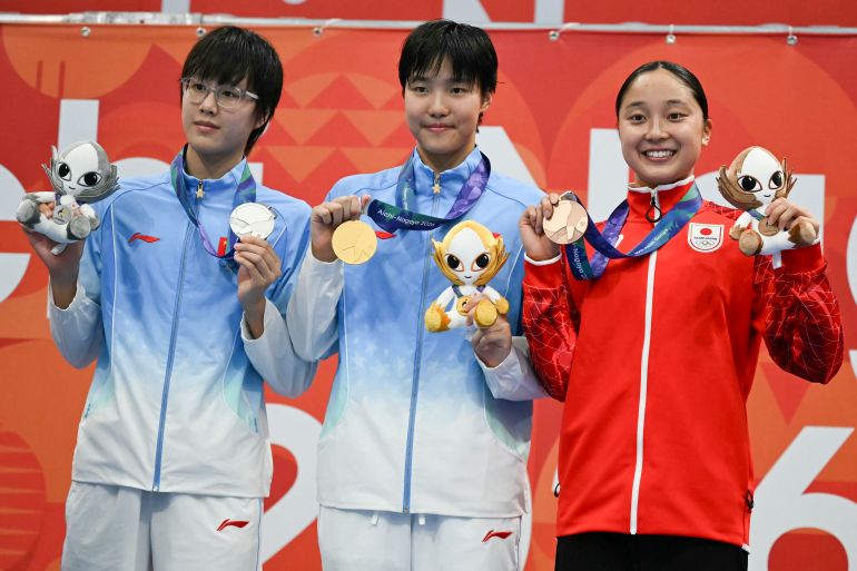 Zwemwonder Yu Zidi (13) completeert hattrick goud op Aziatische Spelen met recordtijd (Picture by: aljazeera.com)